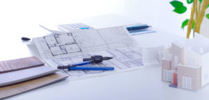 家と図面のイラスト